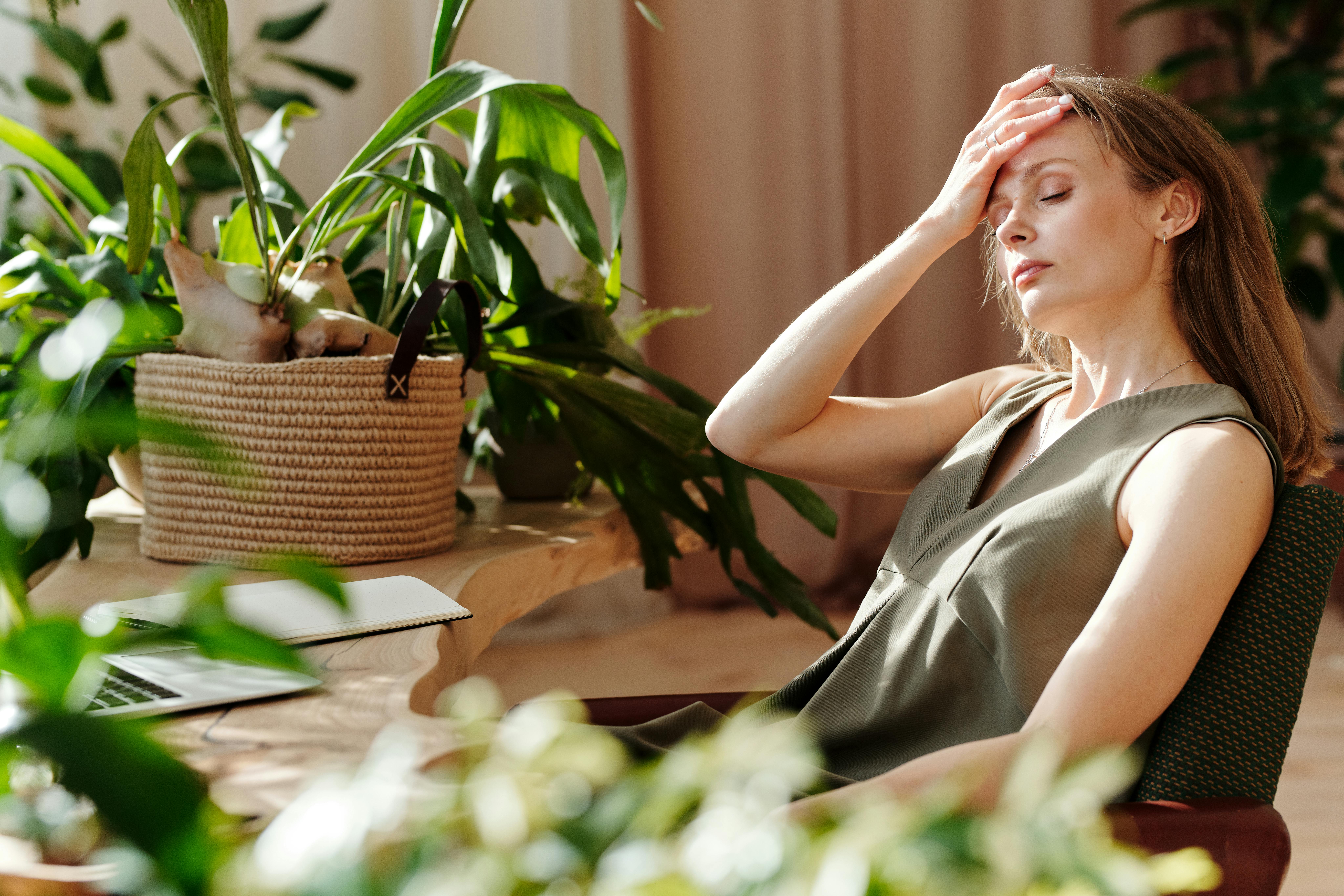 woman appearing tired and stressed