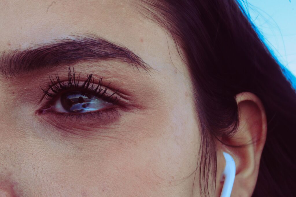 A close up of a woman's eye area, showing fine lines under her eyes