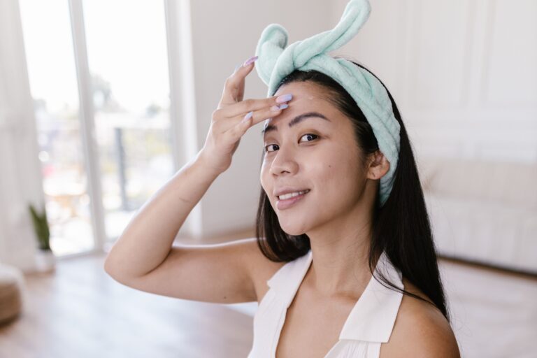 woman with a skincare routine at home